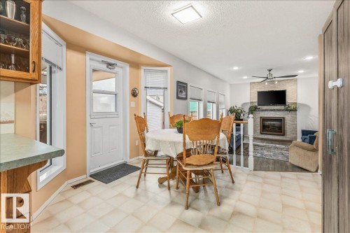 19 Deane Crescent, St. Albert, AB - Indoor Photo Showing Dining Room With Fireplace