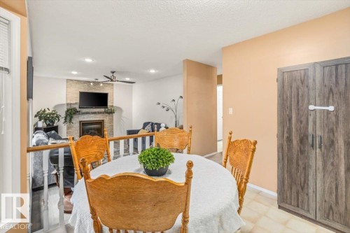 19 Deane Crescent, St. Albert, AB - Indoor Photo Showing Dining Room With Fireplace
