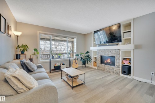 17626 61A Street, Edmonton, AB - Indoor Photo Showing Living Room With Fireplace