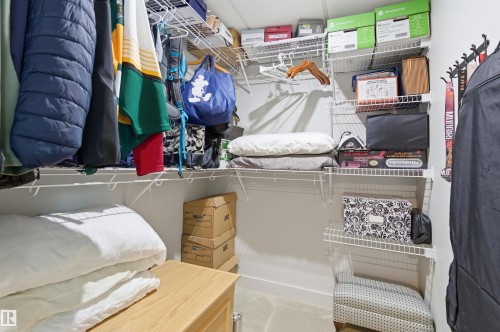 The property features a closet with white wire shelving and hanging rods - 678 Secord Boulevard, Edmonton, AB - Indoor With Storage