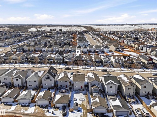 Aerial view of the property and its surrounding neighborhood, featuring a structured street layout with numerous detached homes - 678 Secord Boulevard, Edmonton, AB - Outdoor With View