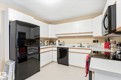 105 8811 106A Avenue, Edmonton, AB - Indoor Photo Showing Kitchen With Double Sink