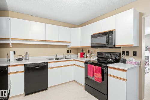 105 8811 106A Avenue, Edmonton, AB - Indoor Photo Showing Kitchen With Double Sink