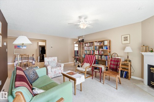 105 8811 106A Avenue, Edmonton, AB - Indoor Photo Showing Living Room With Fireplace