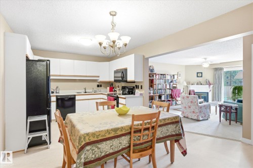105 8811 106A Avenue, Edmonton, AB - Indoor Photo Showing Dining Room With Fireplace