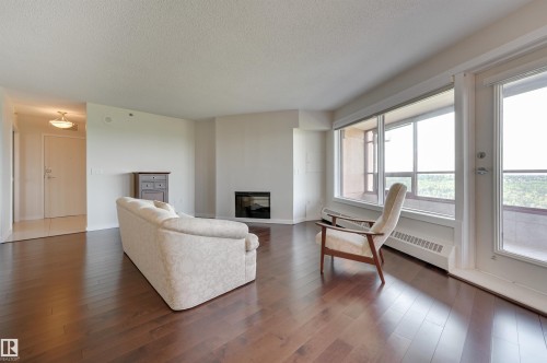 1003 12319 Jasper Avenue, Edmonton, AB - Indoor Photo Showing Living Room With Fireplace