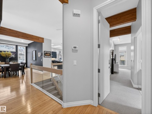 The property features hardwood flooring and an open-concept design - 569 Butterworth Way, Edmonton, AB - Indoor Photo Showing Other Room