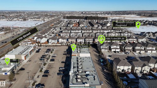 Aerial view showcasing a residential area with proximity to commercial establishments and a main road - 1426 25 Avenue, Edmonton, AB - Outdoor With View