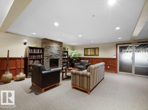 302 1589 Glastonbury Boulevard, Edmonton, AB - Indoor Photo Showing Other Room With Fireplace