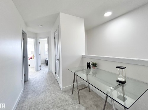 Hall with light colored carpet and recessed lighting - 19634 29 Avenue, Edmonton, AB - Indoor Photo Showing Other Room