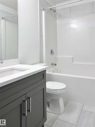 Bathroom with vanity and washtub / shower combination - 19634 29 Avenue, Edmonton, AB - Indoor Photo Showing Bathroom