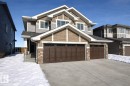 Craftsman house with stone siding, driveway, a garage, and a shingled roof - 19634 29 Avenue, Edmonton, AB  - Outdoor 