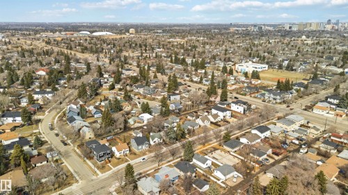 Aerial perspective showcasing a residential neighborhood with varied architectural styles and mature trees - 6036 106 Street, Edmonton, AB - Outdoor With View