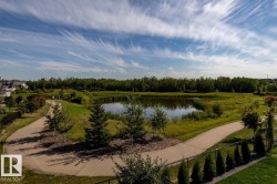 Pond-front property with a naturalized shoreline and surrounding green space - 