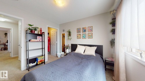 This room features neutral-toned walls, a window with sheer curtains, and carpeted flooring - 1275 Chappelle Boulevard, Edmonton, AB 