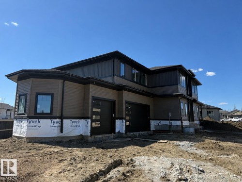 Contemporary exterior with brown horizontal siding and dark vertical accents - 33 Harley Way Nw, Spruce Grove, AB - Outdoor