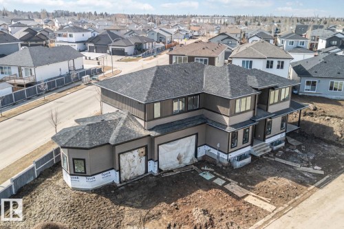 This property features a two-story design with a prominent bay window - 33 Harley Way Nw, Spruce Grove, AB - Outdoor