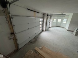 Two garage doors with upper-panel window inserts - 
