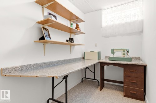 The room features white walls, a window with a white curtain, and light-colored flooring - 10716 52 Avenue, Edmonton, AB - Indoor