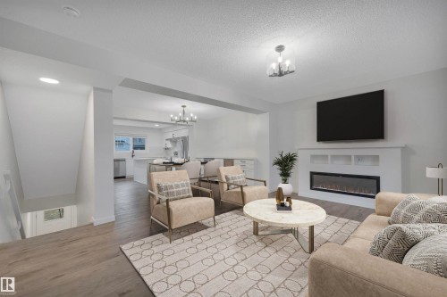 79 50 Mclaughlin Drive, Spruce Grove, AB - Indoor Photo Showing Living Room With Fireplace