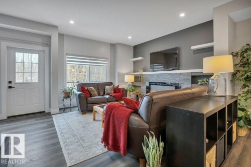 58 230 Edgemont Road, Edmonton, AB - Indoor Photo Showing Living Room With Fireplace