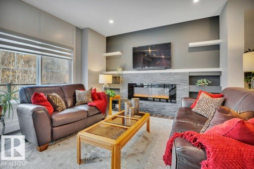 58 230 Edgemont Road, Edmonton, AB - Indoor Photo Showing Living Room With Fireplace