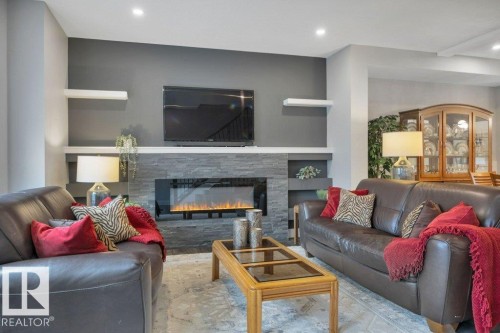 58 230 Edgemont Road, Edmonton, AB - Indoor Photo Showing Living Room With Fireplace