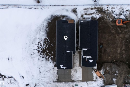 Aerial view of the property with a dark shingled roof and a concrete driveway - 190 Elliott Wynd, Fort Saskatchewan, AB - Outdoor