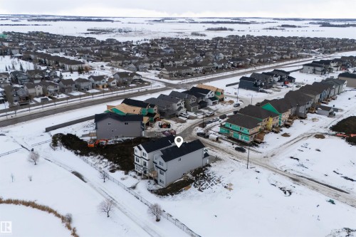 This property is located within an established neighbourhood featuring numerous detached homes and a comprehensive street network - 190 Elliott Wynd, Fort Saskatchewan, AB - Outdoor With View