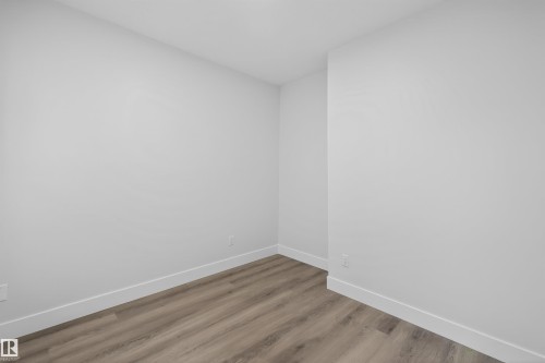 This room features light-colored flooring, white walls, and white baseboards - 190 Elliott Wynd, Fort Saskatchewan, AB - Indoor Photo Showing Other Room