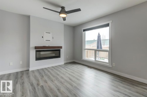 1714 169 St Sw, Edmonton, AB - Indoor Photo Showing Living Room With Fireplace