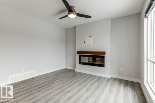 1714 169 St Sw, Edmonton, AB - Indoor Photo Showing Living Room With Fireplace