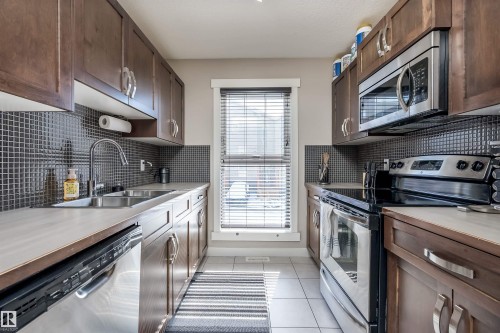 160 401 Southfork Drive, Leduc, AB - Indoor Photo Showing Kitchen With Double Sink With Upgraded Kitchen