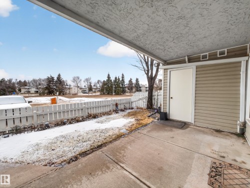The property features a covered patio with a concrete surface - 165 2703 79 Street, Edmonton, AB - Outdoor With Exterior