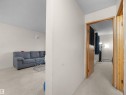 The interior features neutral-toned walls and light-colored carpet flooring throughout, providing a versatile foundation for various design preferences - 214 2620 Mill Woods Road E, Edmonton, AB  - Indoor Photo Showing Other Room 