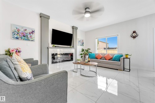 1522 17 Avenue, Edmonton, AB - Indoor Photo Showing Living Room With Fireplace