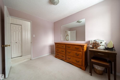 This room features light-colored carpeting, pale purple walls, and a white ceiling - 11 Granada Place, St. Albert, AB - Indoor
