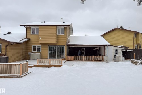 The property features a spacious rear yard with a deck and a detached shed - 11 Granada Place, St. Albert, AB - Outdoor With Deck Patio Veranda With Exterior