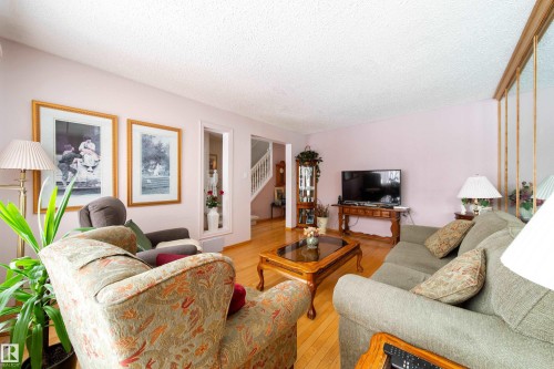 This living area features hardwood floors and light-colored walls - 11 Granada Place, St. Albert, AB - Indoor Photo Showing Living Room