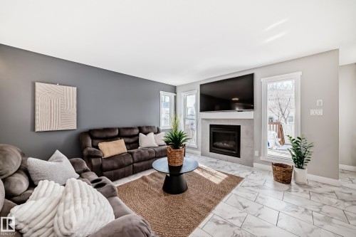 4404 6 Street, Edmonton, AB - Indoor Photo Showing Living Room With Fireplace