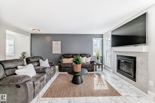 4404 6 Street, Edmonton, AB - Indoor Photo Showing Living Room With Fireplace