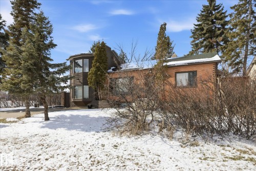 The property features a brick exterior and a rounded bay window - 11026 110 Avenue, Edmonton, AB - Outdoor