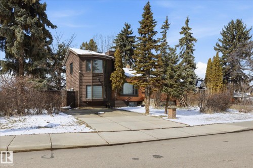 The property features a brown exterior with multiple windows and a curved architectural element - 11026 110 Avenue, Edmonton, AB - Outdoor