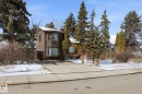 The property features a brown exterior with multiple windows and a curved architectural element - 11026 110 Avenue, Edmonton, AB  - Outdoor 