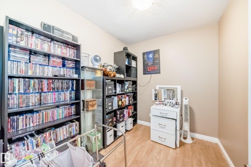 This interior room features light-colored walls and wood flooring - 307 10121 80 Avenue, Edmonton, AB - Indoor Photo Showing Other Room