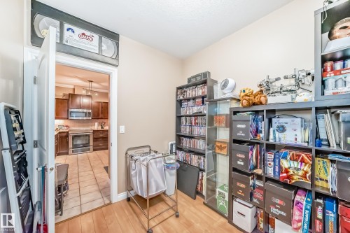 This interior space features light-colored walls and hardwood flooring - 307 10121 80 Avenue, Edmonton, AB - Indoor