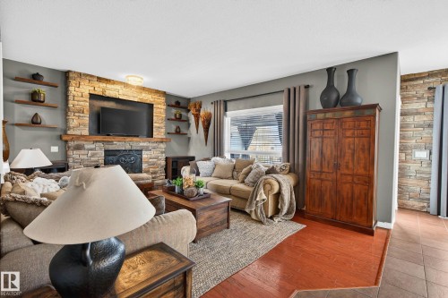3 Erin Close, St. Albert, AB - Indoor Photo Showing Living Room With Fireplace