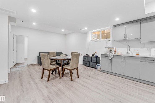 This open-concept living space features light-toned flooring and recessed lighting - 449 Roberts Crescent, Leduc, AB - Indoor