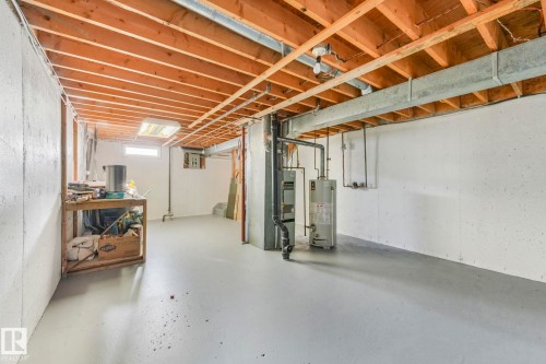 Basement with water heater and heating unit - 5833 Riverbend Road, Edmonton, AB - Indoor Photo Showing Basement