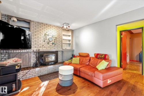3018 110A Street, Edmonton, AB - Indoor Photo Showing Living Room With Fireplace